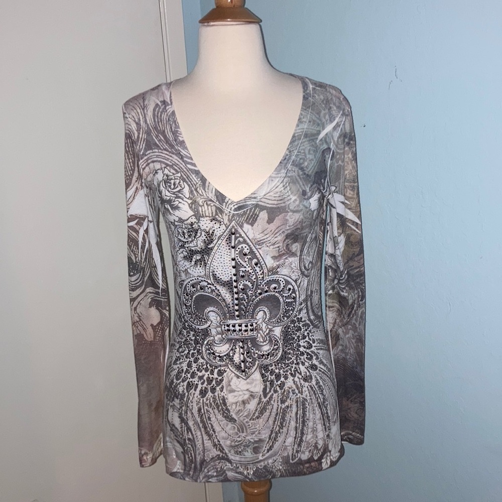 Woman’s long sleeved beaded top
